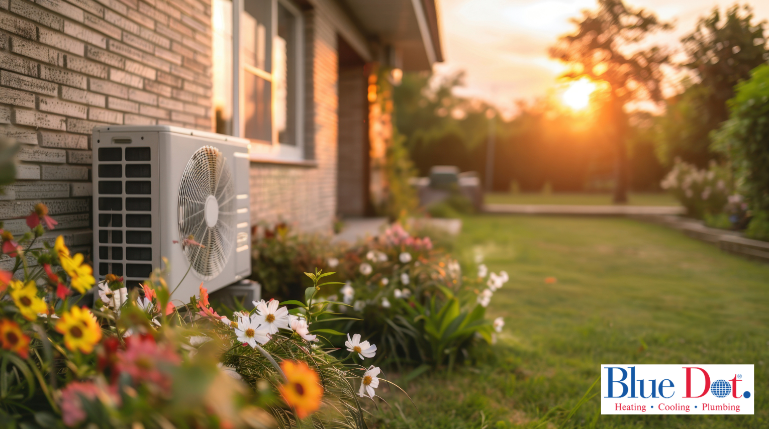 Newly installed heat pump on an older home in Maryland with a grassy backyard with flowers.